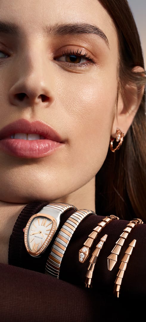 Image 30: Model wearing Serpenti Viper bracelets and Serpenti Tubogas watch.
