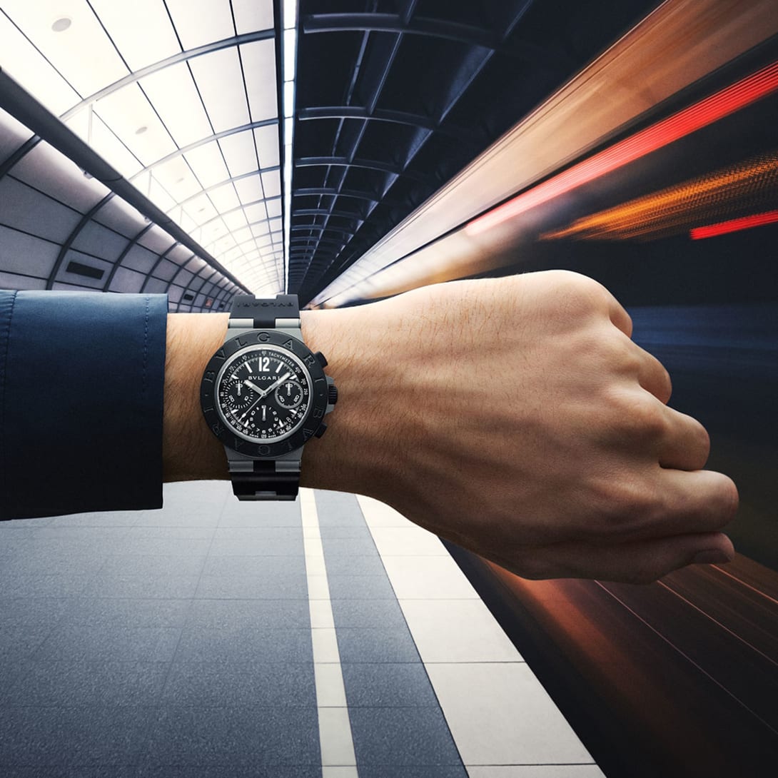 Bvlgari Titanio Chronograph watch in Grade 5 titanium worn on the wrist against a futuristic backdrop.