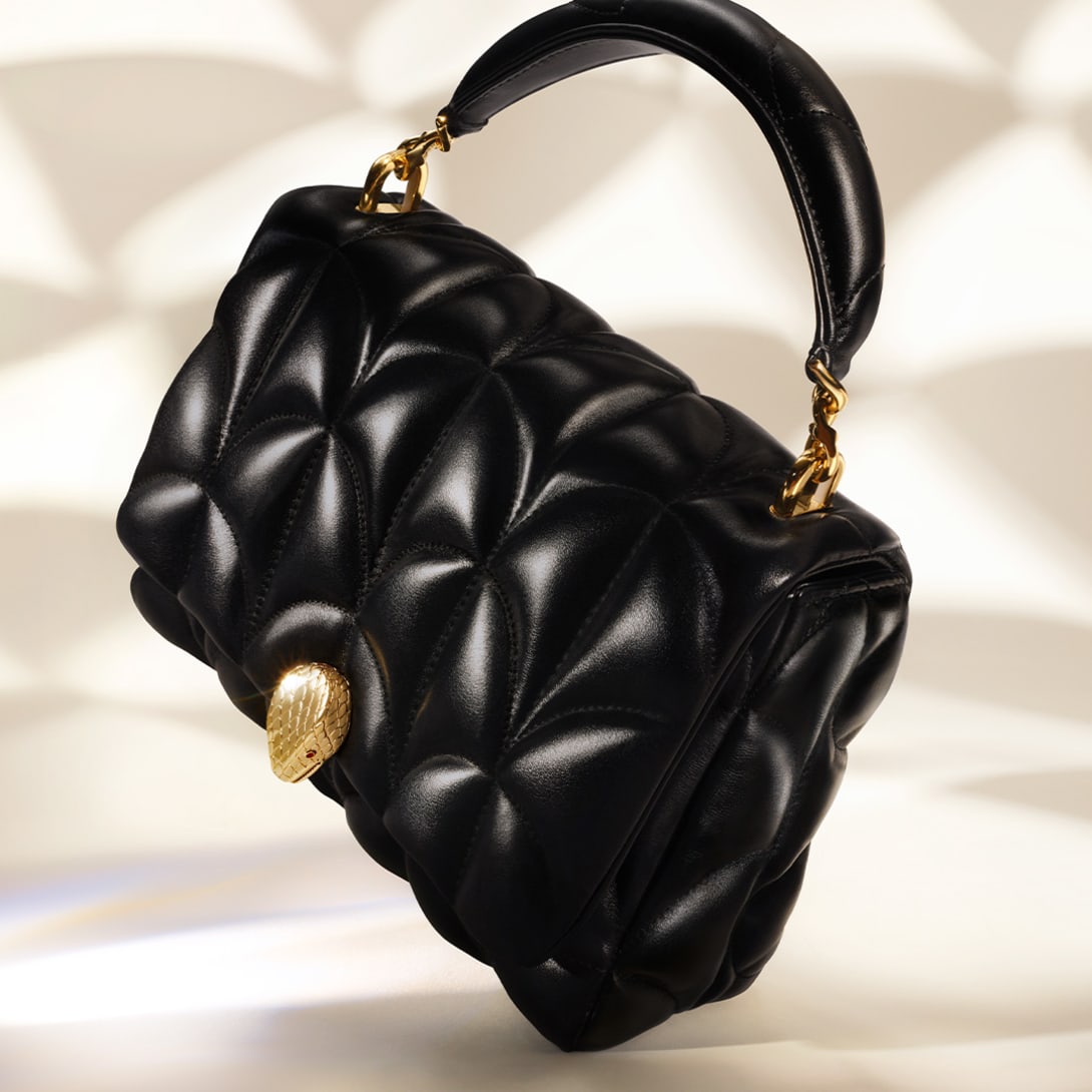 Serpenti Sugarloaf black calf leather bag with top handle, Calla Matelassé motif and snakehead closure.
