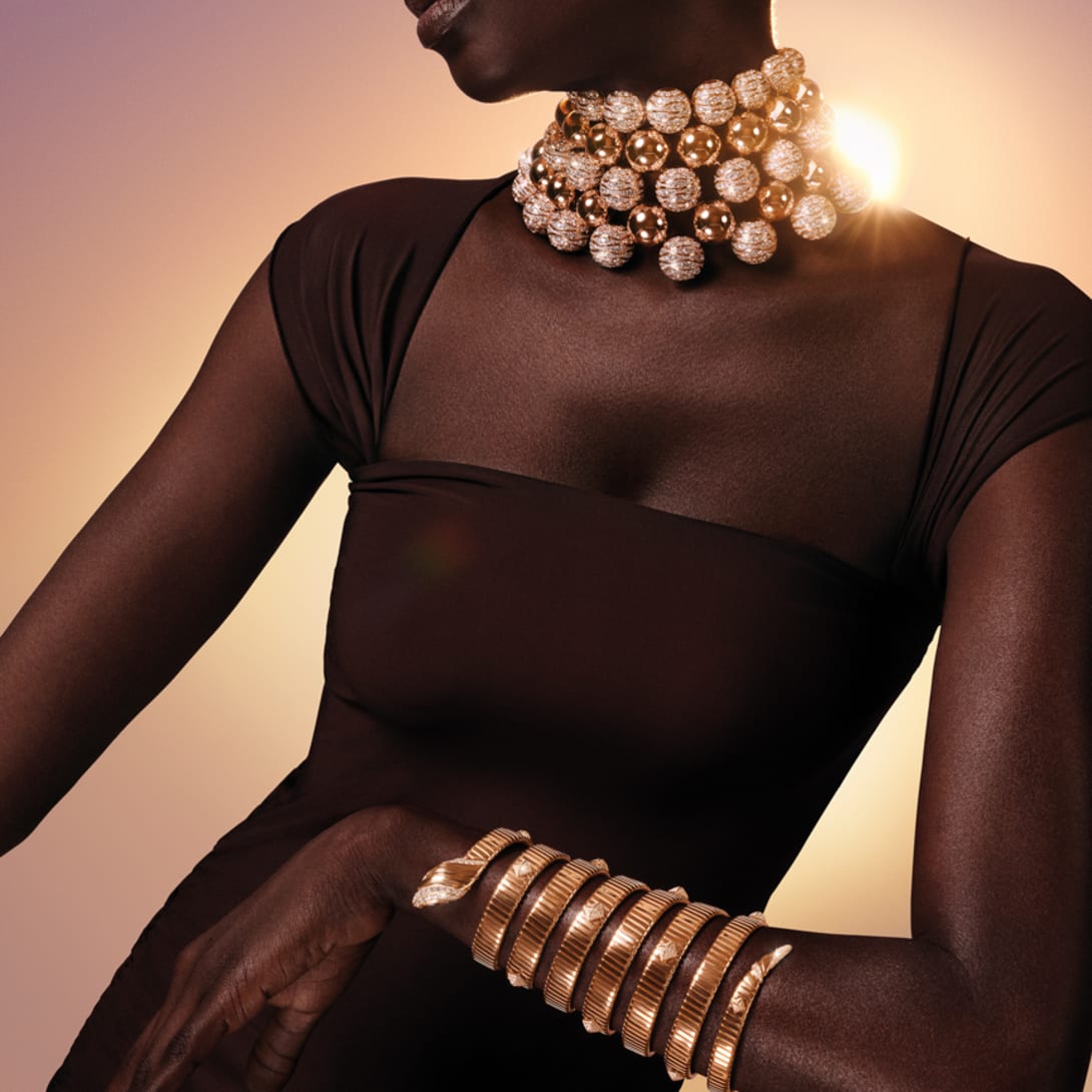 Model wearing High Jewellery rose gold and diamond necklace, and the Serpenti Tubogas watch.