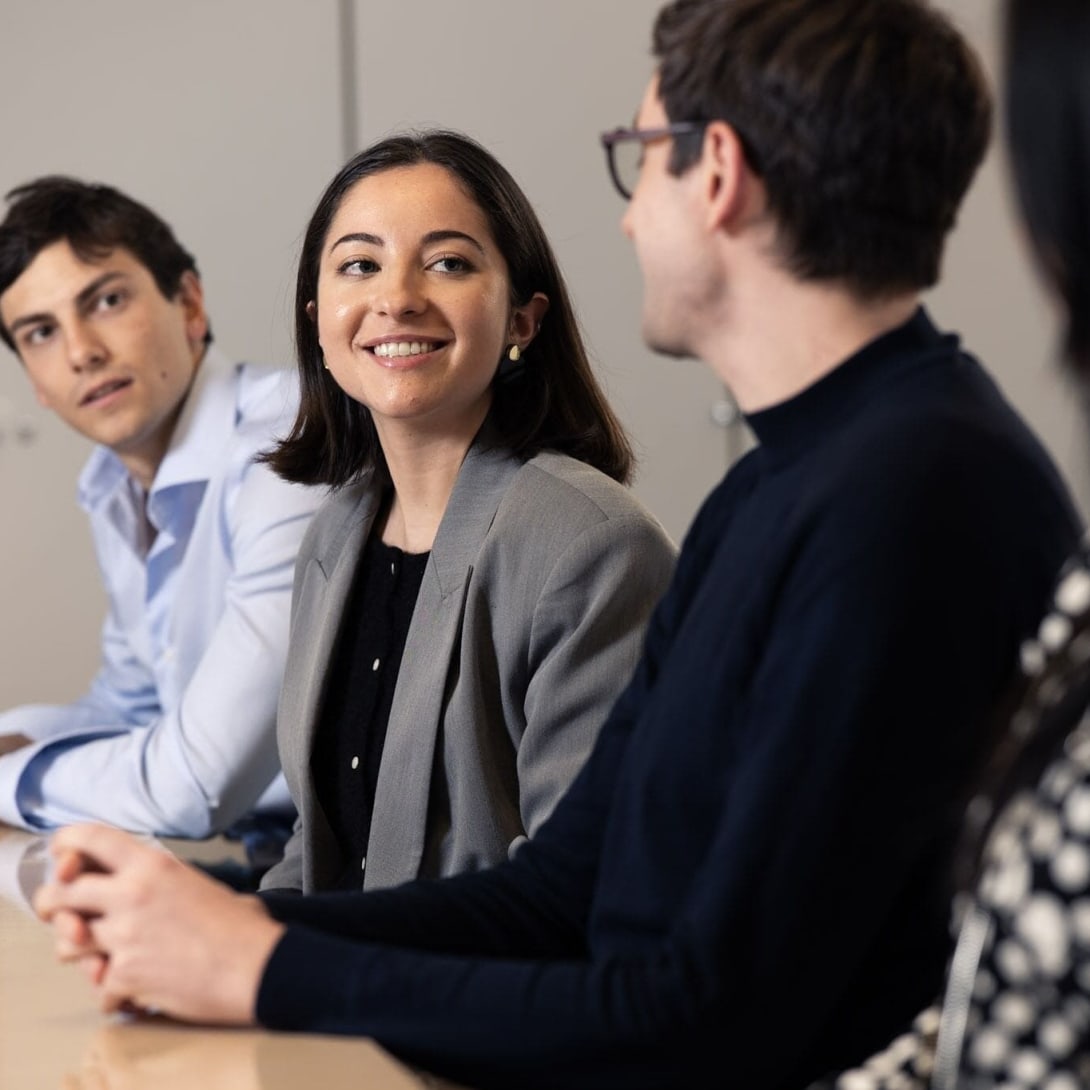 Three Bulgari employees talking during a meeting