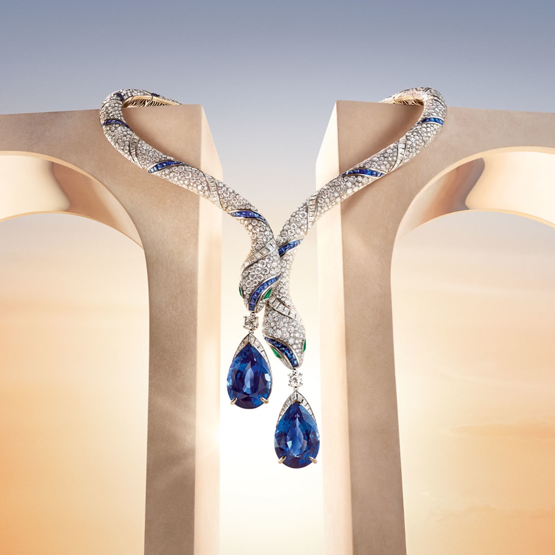 The Serpenti High Jewellery sapphire and diamond necklace, Roman architectural elements and the sky at dawn.