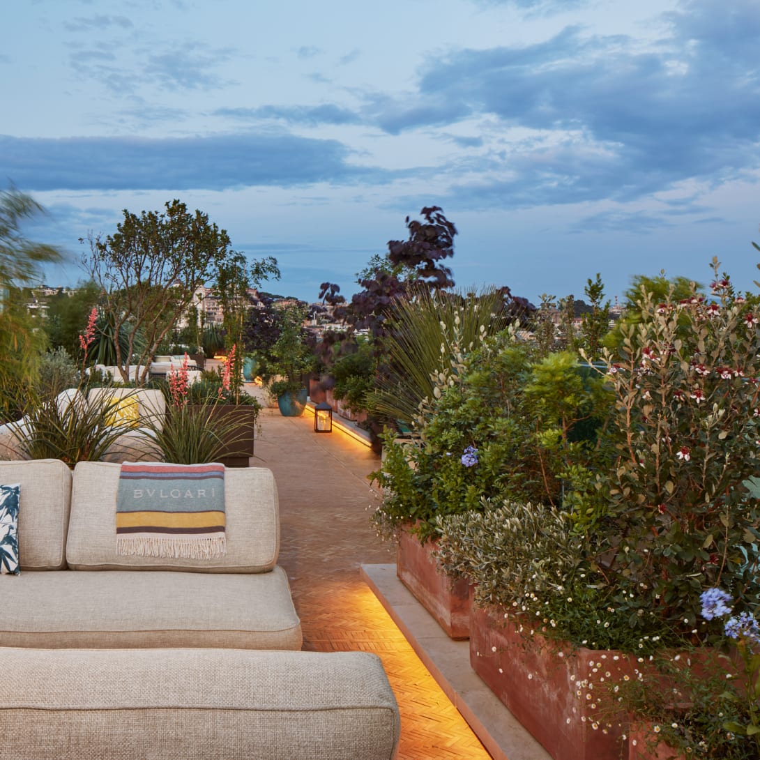 A rooftop terrace featuring lush vegetation, La Terrazza