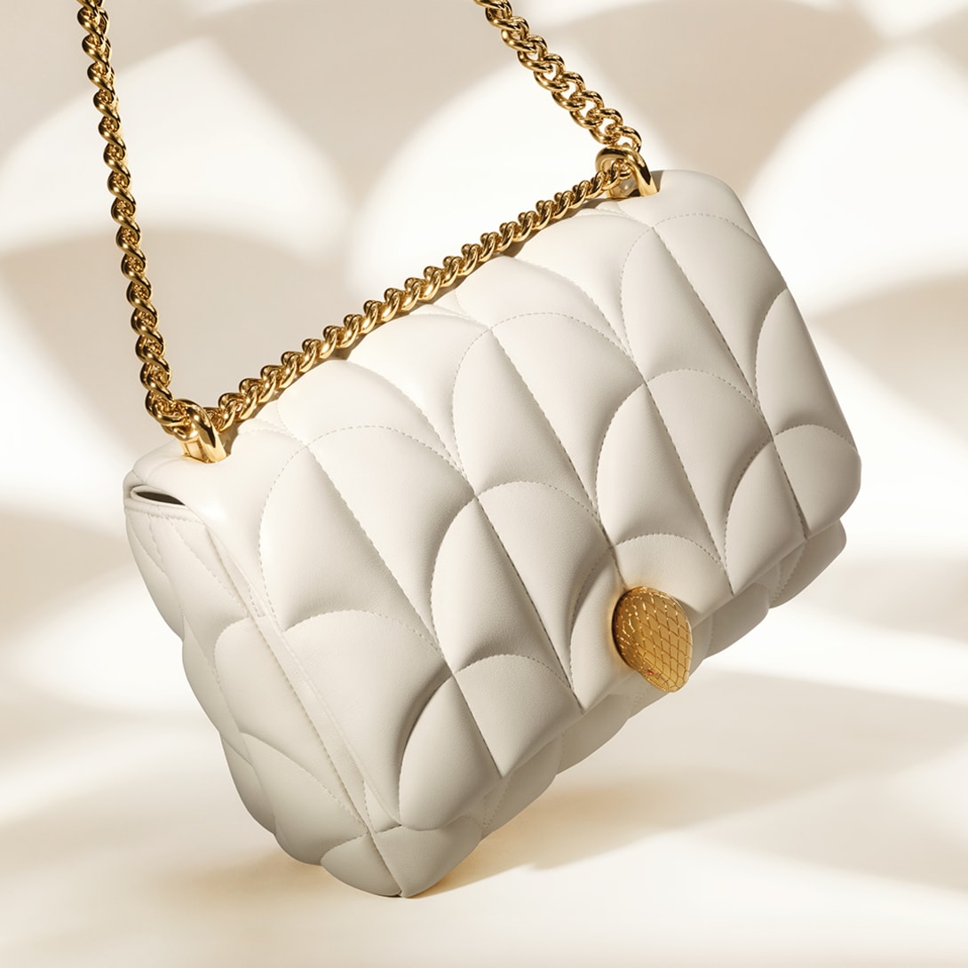 Serpenti Sugarloaf white calf leather shoulder bag with Calla Matelassé motif and snakehead closure.