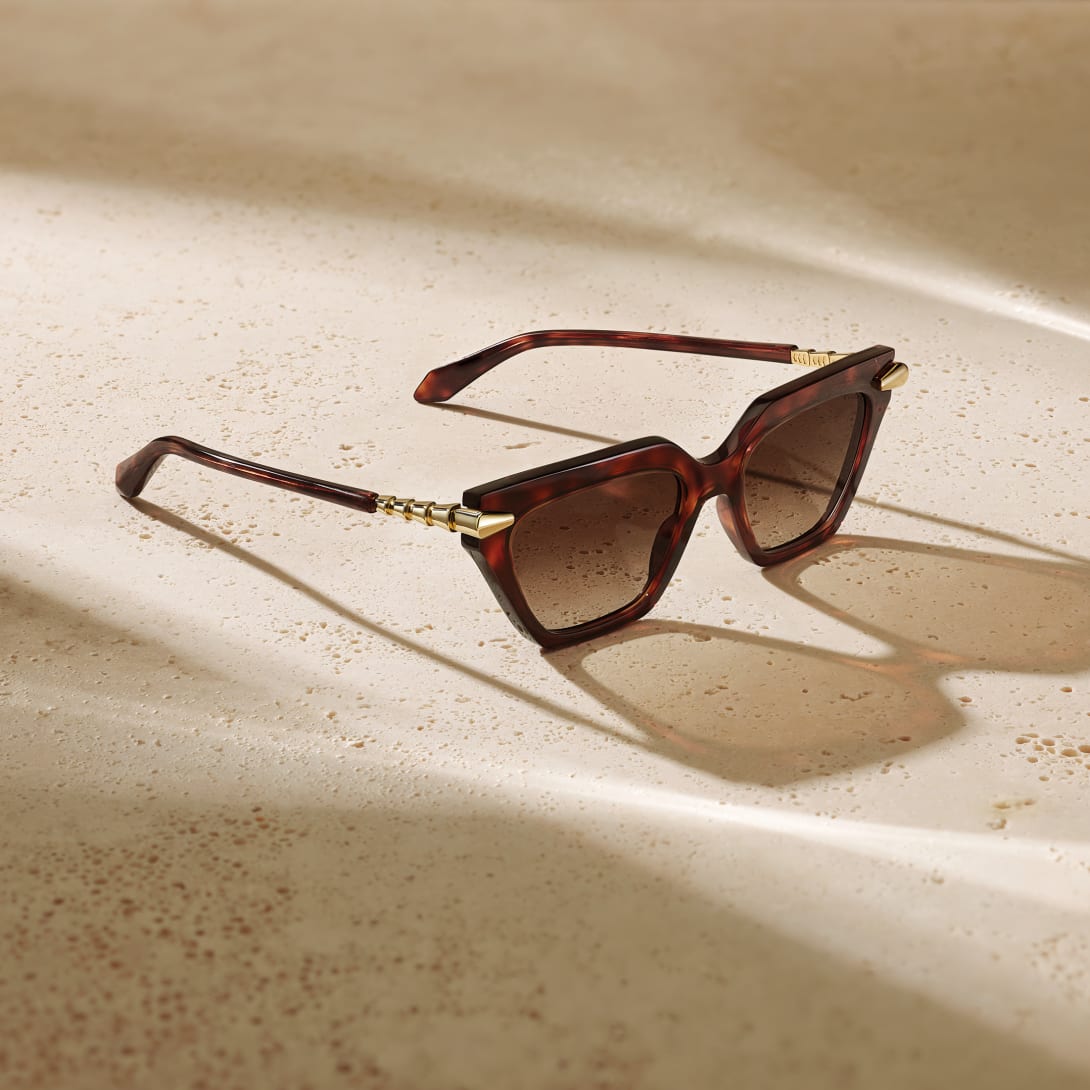 Serpenti Viper sunglasses with shiny black frame and shiny rose gold-finish snake-inspired temples.