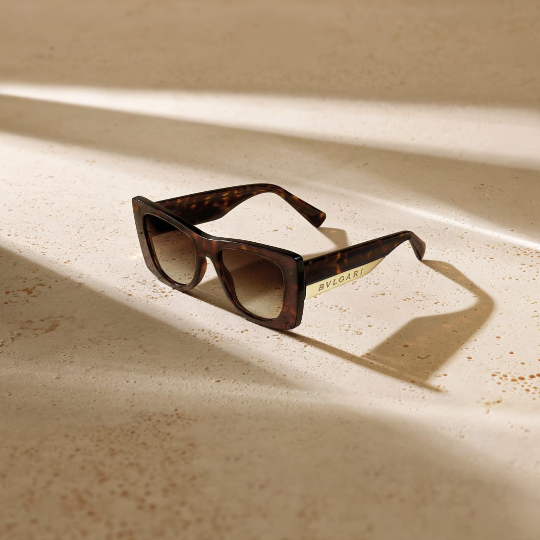 Bvlgari Roma sunglasses with shiny black cat-eye frame and metal plaque on the temples.