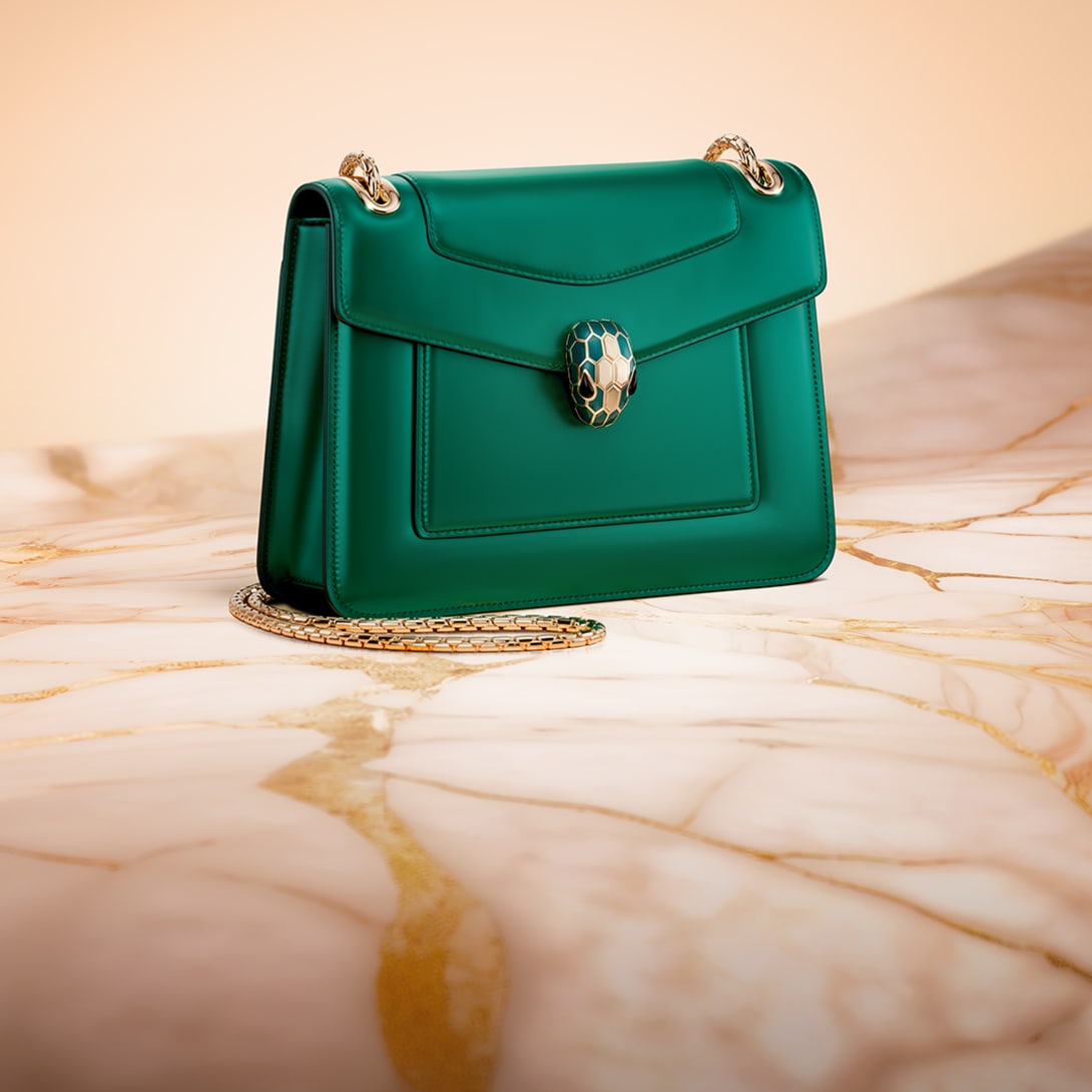 Serpenti Forever Day-to-Night small shoulder bag in emerald green calf leather with black nappa leather lining