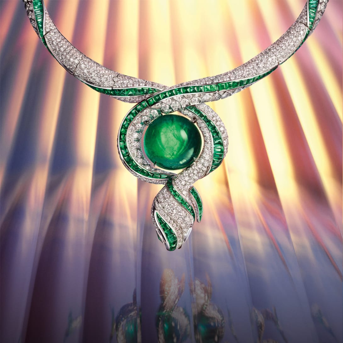 The Terra Mater Serpenti High Jewellery necklace with emeralds and diamonds, creative picture.