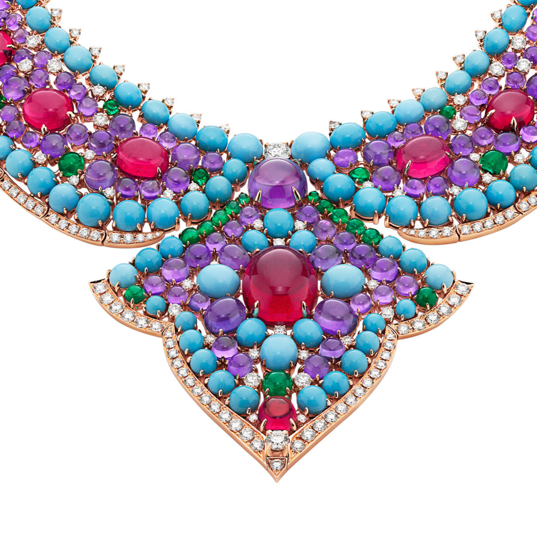 The Bvlgari Lotus Cabochon High Jewellery necklace with rubellite, emerald, turquoise and amethyst cabochon, close-up.