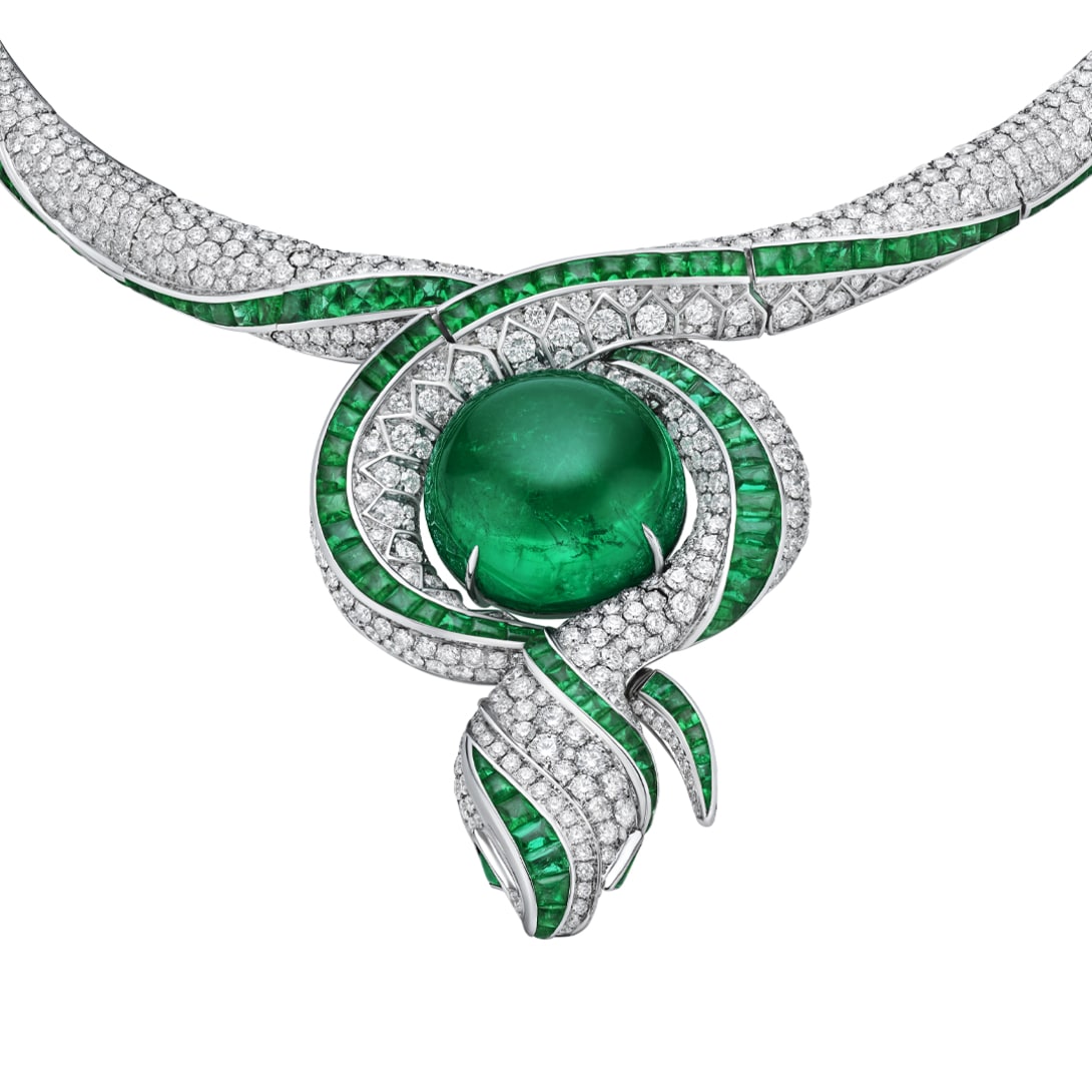 The Terra Mater Serpenti High Jewellery necklace with emeralds and diamonds, close-up.