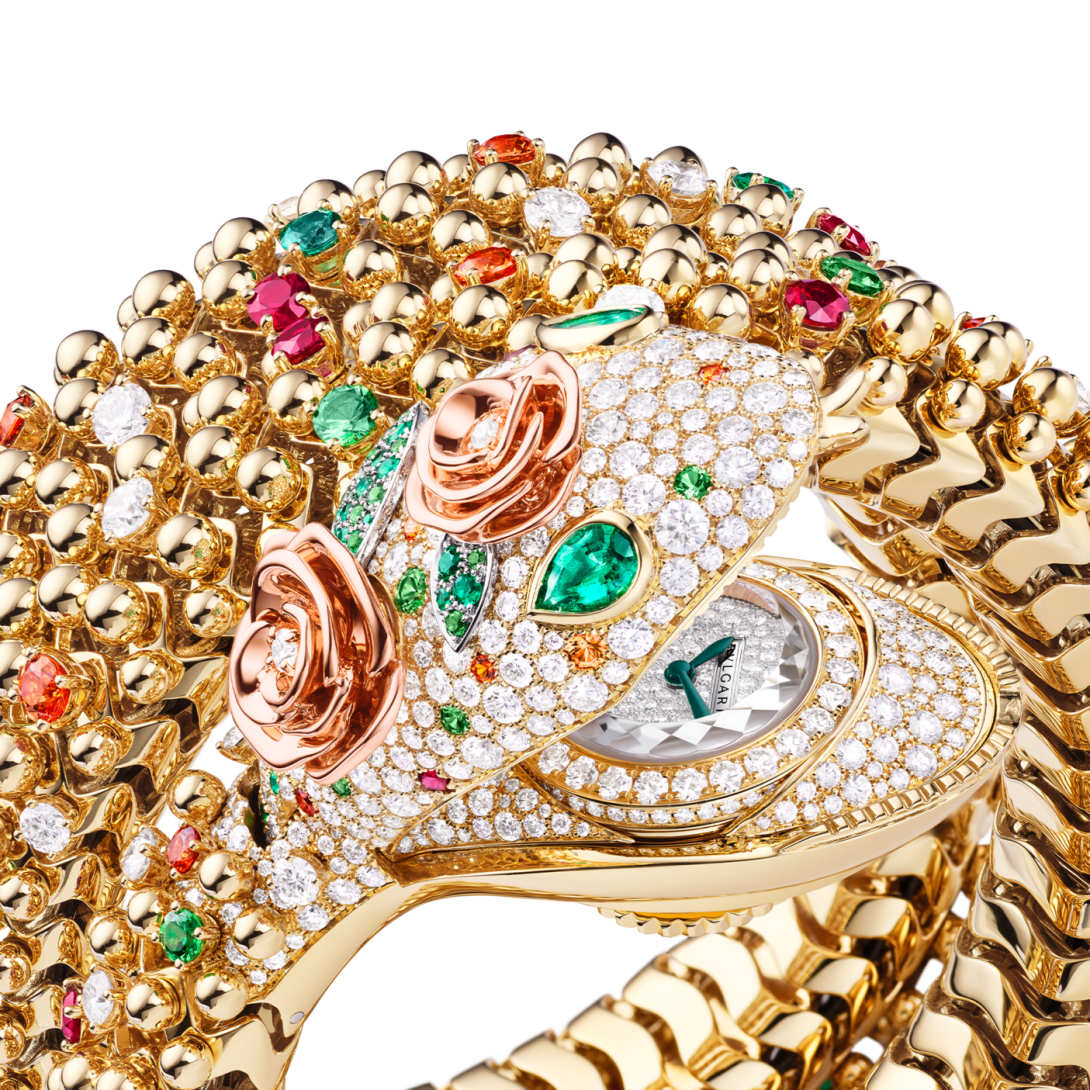 Serpenti Pallini High Jewellery yellow gold secret watch with coral roses and diamonds, close up.