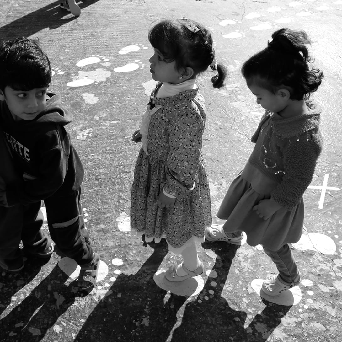 Children playing, image representing the partnership between Bvlgari and Save the Children.