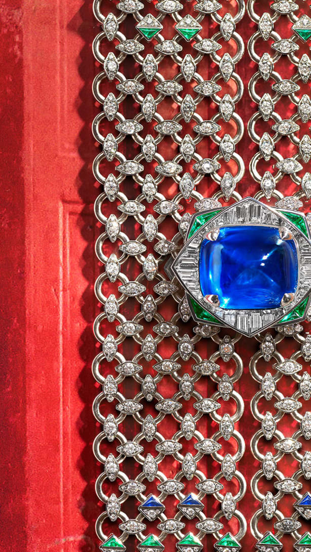 Seres Scarf High Jewellery white gold necklace set with a cushion sapphire, emeralds, sapphires and diamonds.