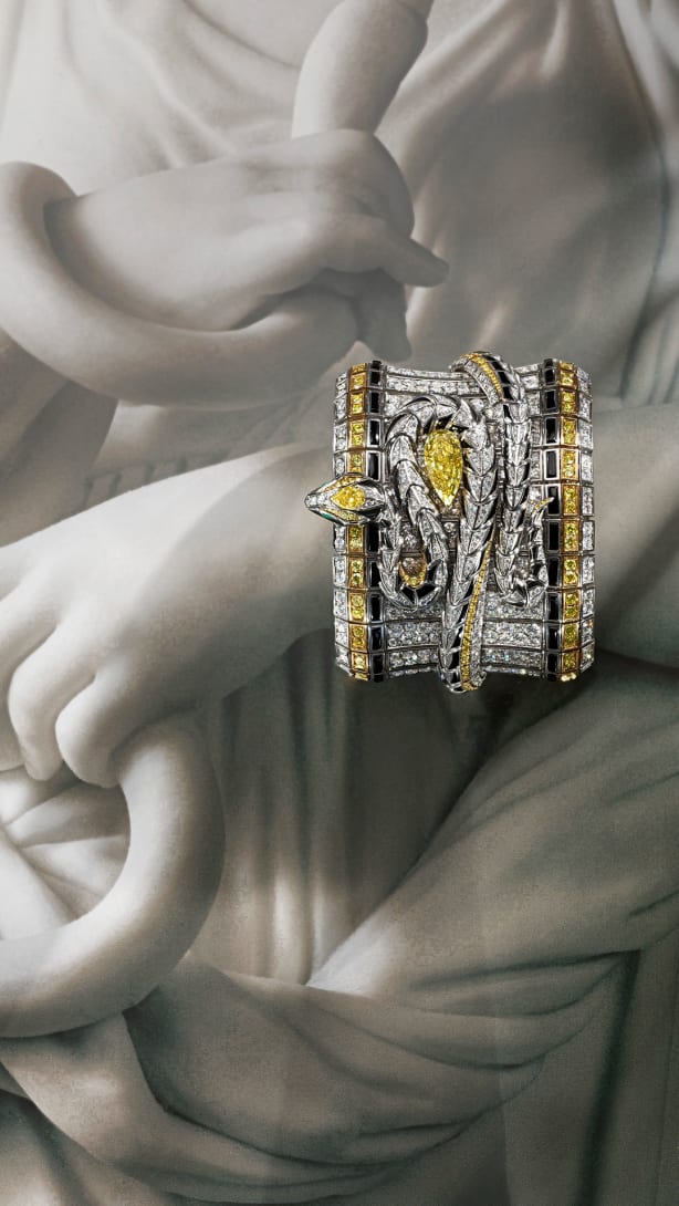 Serpenti Spira High Jewellery white gold cuff with yellow diamonds, onyx elements and diamonds.