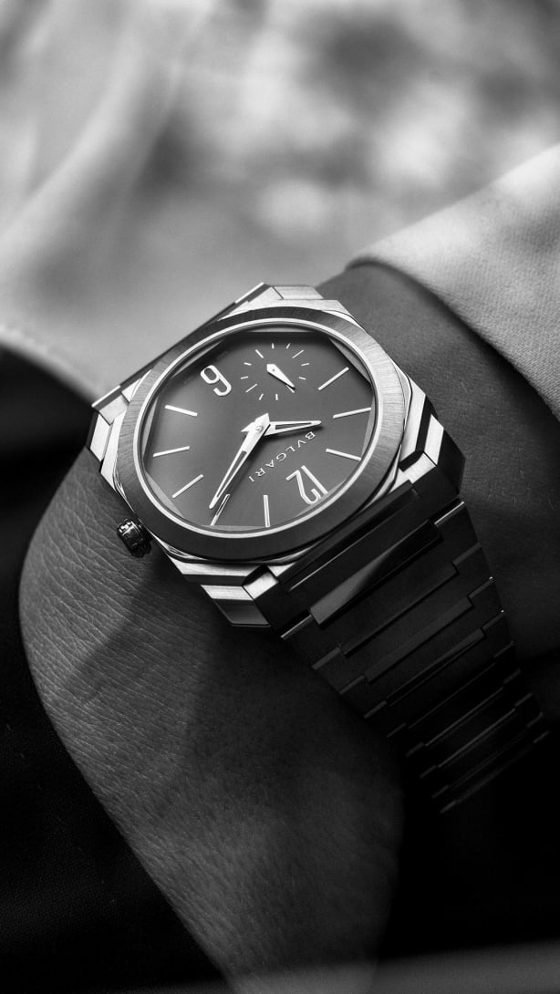 Octo Finissimo 37 ultra-thin automatic watch in satin-polished titanium, creative shot from the side.