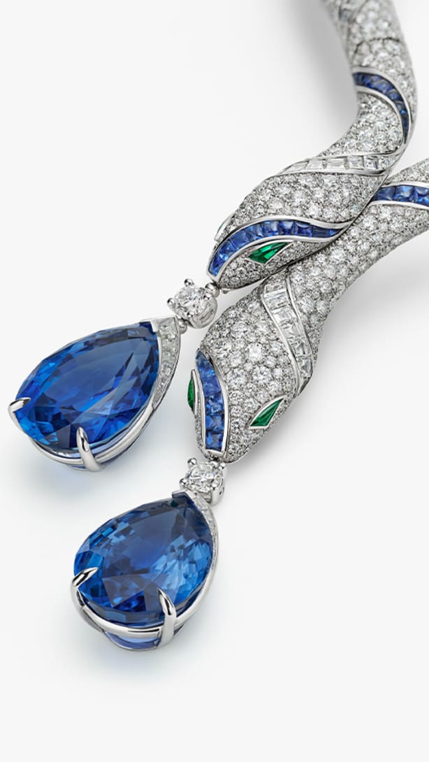 The Serpenti Sapphire Echo High Jewellery necklace with sapphires, diamonds and emeralds, full view.