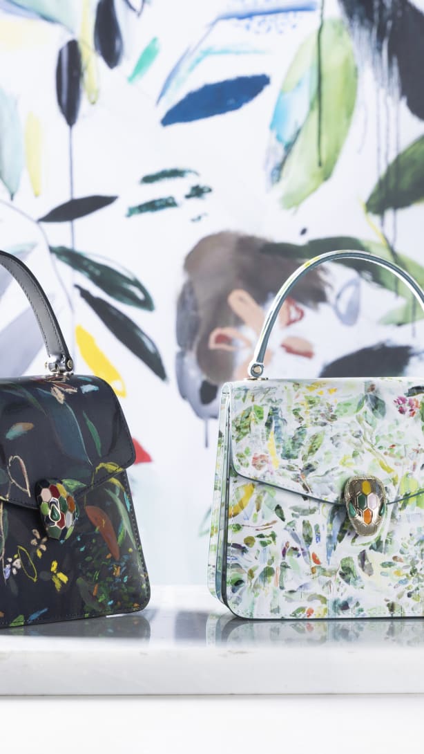 Serpenti Forever Top Handle bags in white and black calf leather with leaves motif, designed by artist Sophie Kitching.