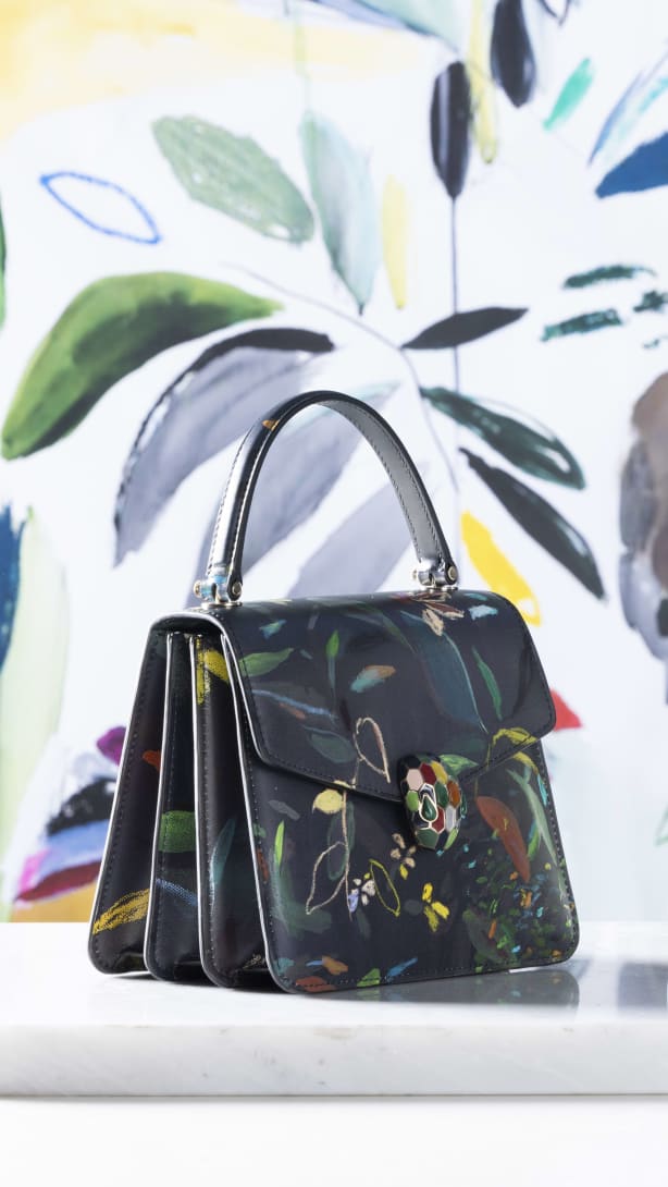 Serpenti Forever Top Handle bags in white and black calf leather with leaves motif, designed by artist Sophie Kitching.