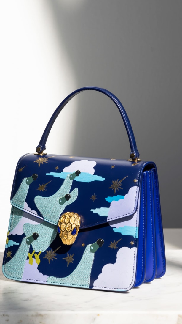 Serpenti Forever Top Handle bags in green and blue calf leather, designed by artist Sunwoo Kim.