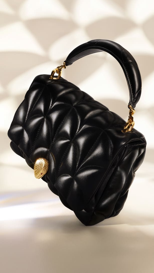 Serpenti Sugarloaf black calf leather bag with top handle, Calla Matelassé motif and snakehead closure.