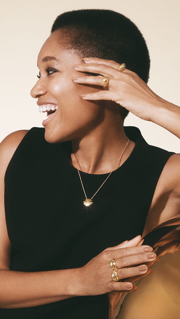 Model wearing Bvlgari Cabochon jewels.