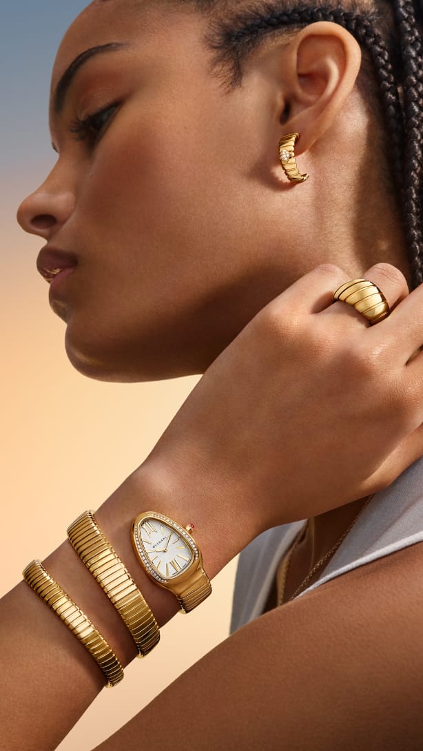 Model wearing Serpenti watch and Tubogas jewellery, Magnificent Icons campaign.