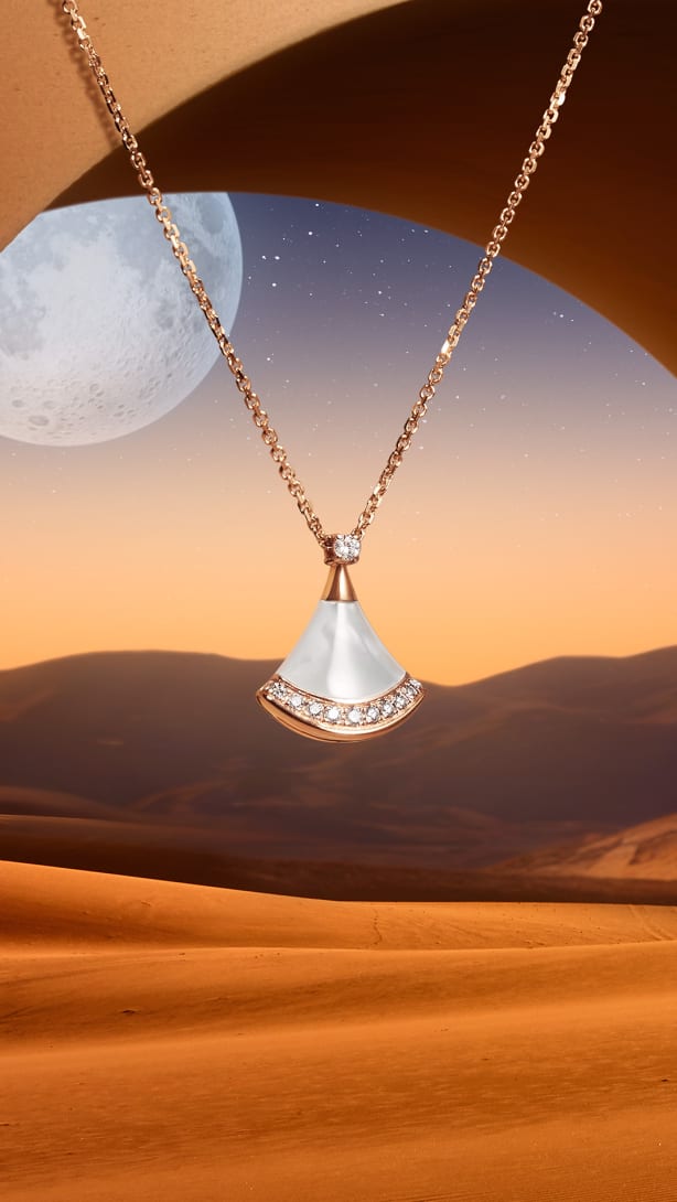 Divas' Dream rose gold necklace with mother-of-pearl and diamonds set against a starry night.