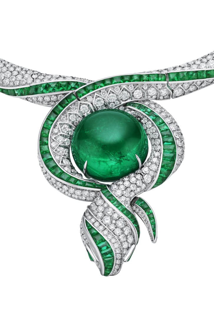The Terra Mater Serpenti High Jewellery necklace with emeralds and diamonds, close-up.