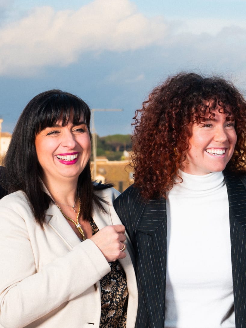 Four Bvlgari employees standing together and laughing