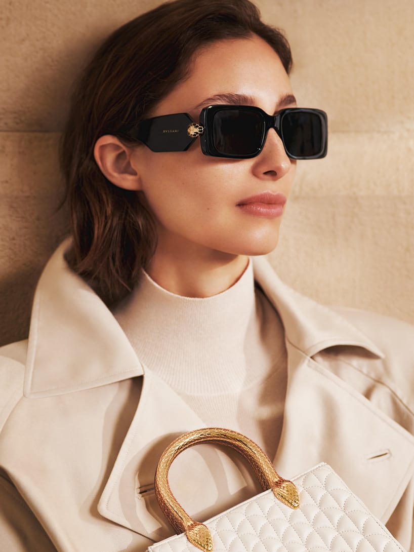 Model wearing Bvlgari Tubogas semi-rimless cat-eye sunglasses and Tubogas necklaces.