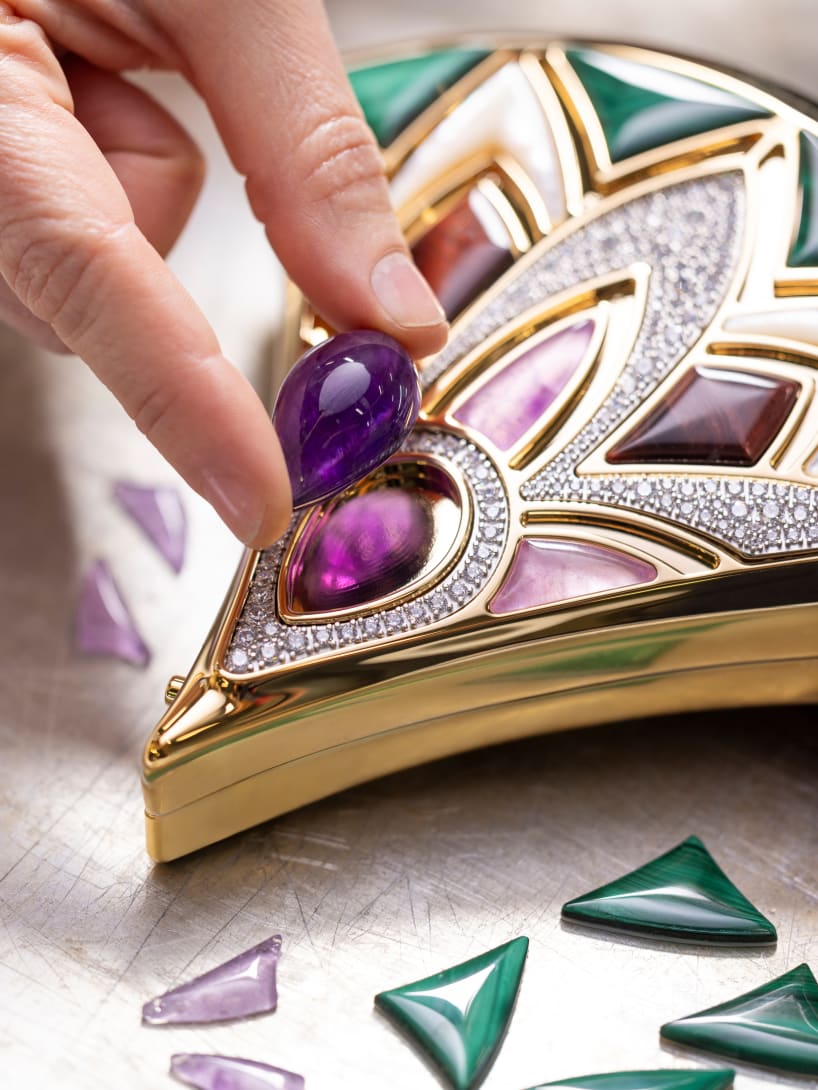Making of Divas’ Dream clutch with fan-shaped design and precious stone inlays.