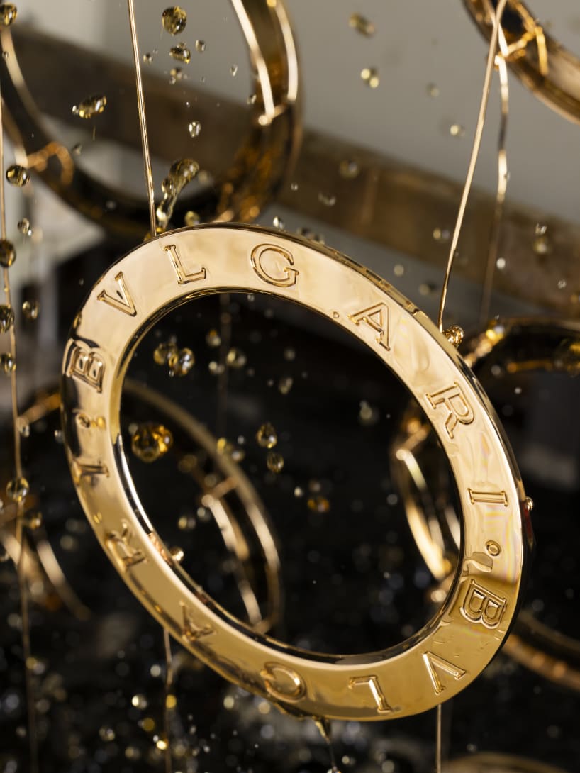 Making of BVLGARI BVLGARI clutch with cylindrical silhouette and mother-of-pearl intarsia.