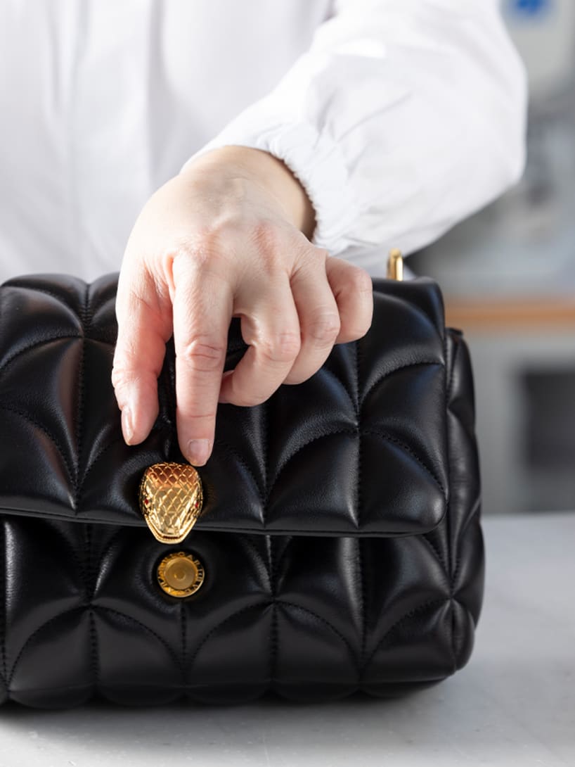 Making of the Serpenti Sugarloaf black calf leather bag with maxi Calla Matelassé motif, close up.