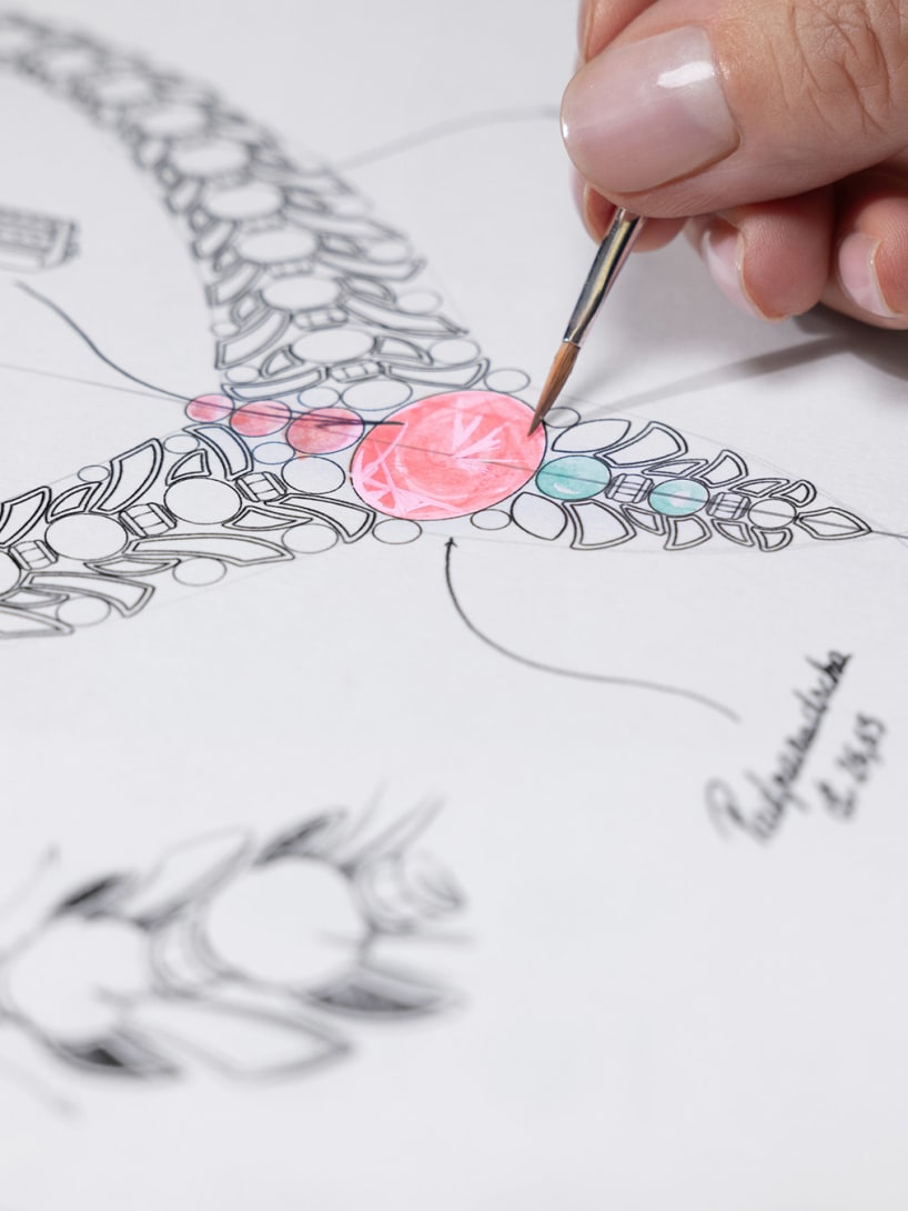 Hand painting the Secret Garden High Jewellery platinum necklace with Padparadscha sapphire sketch.