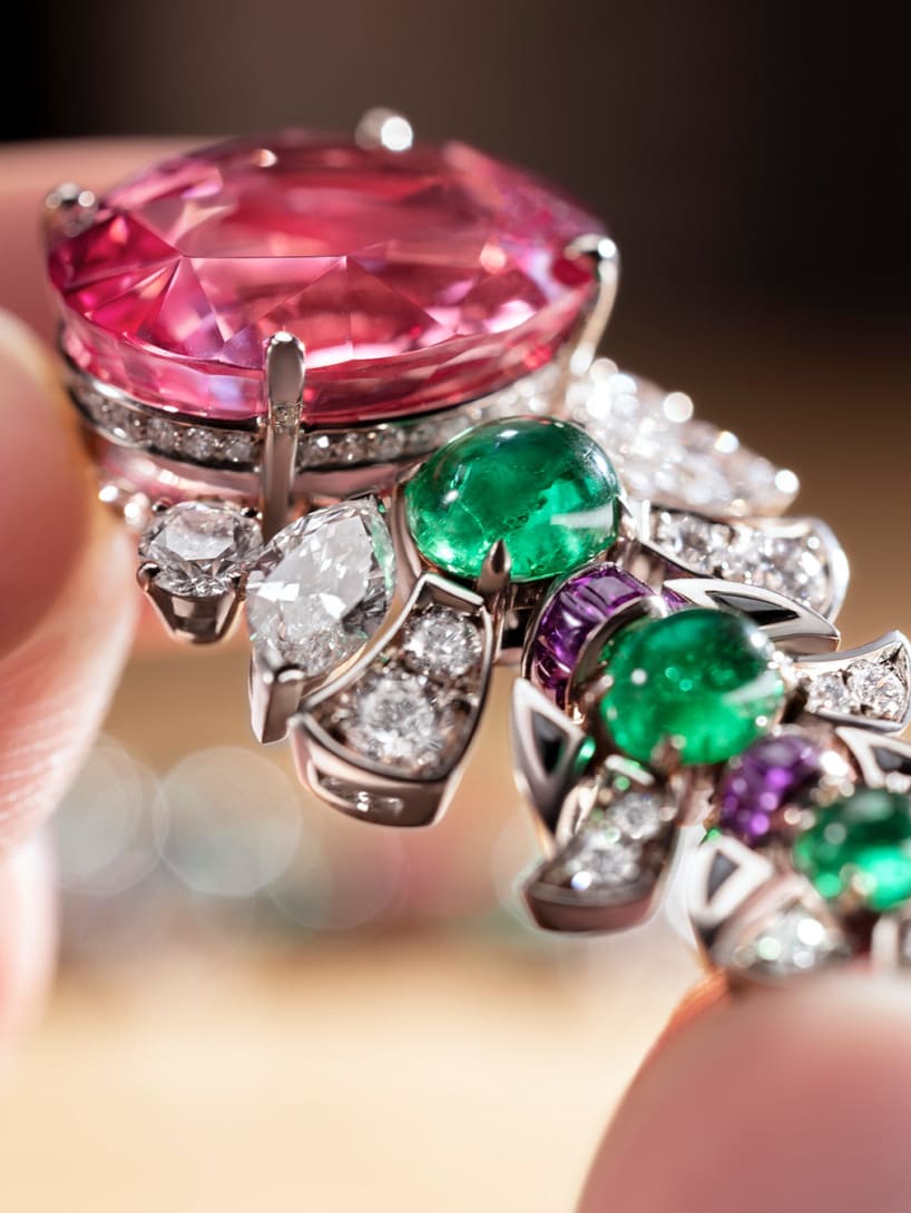 Detail of Secret Garden High Jewellery necklace set with a Padparadscha sapphire, emeralds and diamonds.