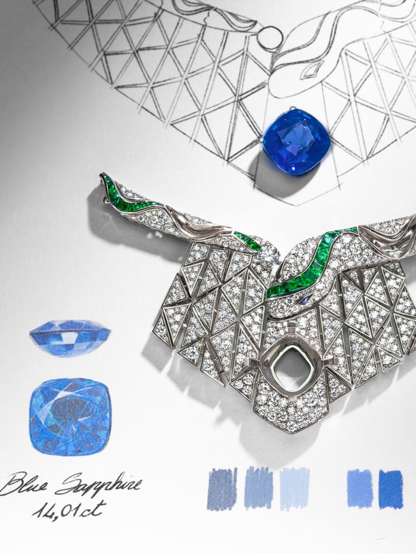 Work in progress Serpenti Illusio High Jewellery necklace with a sapphire, diamonds, emeralds, sketch behind.