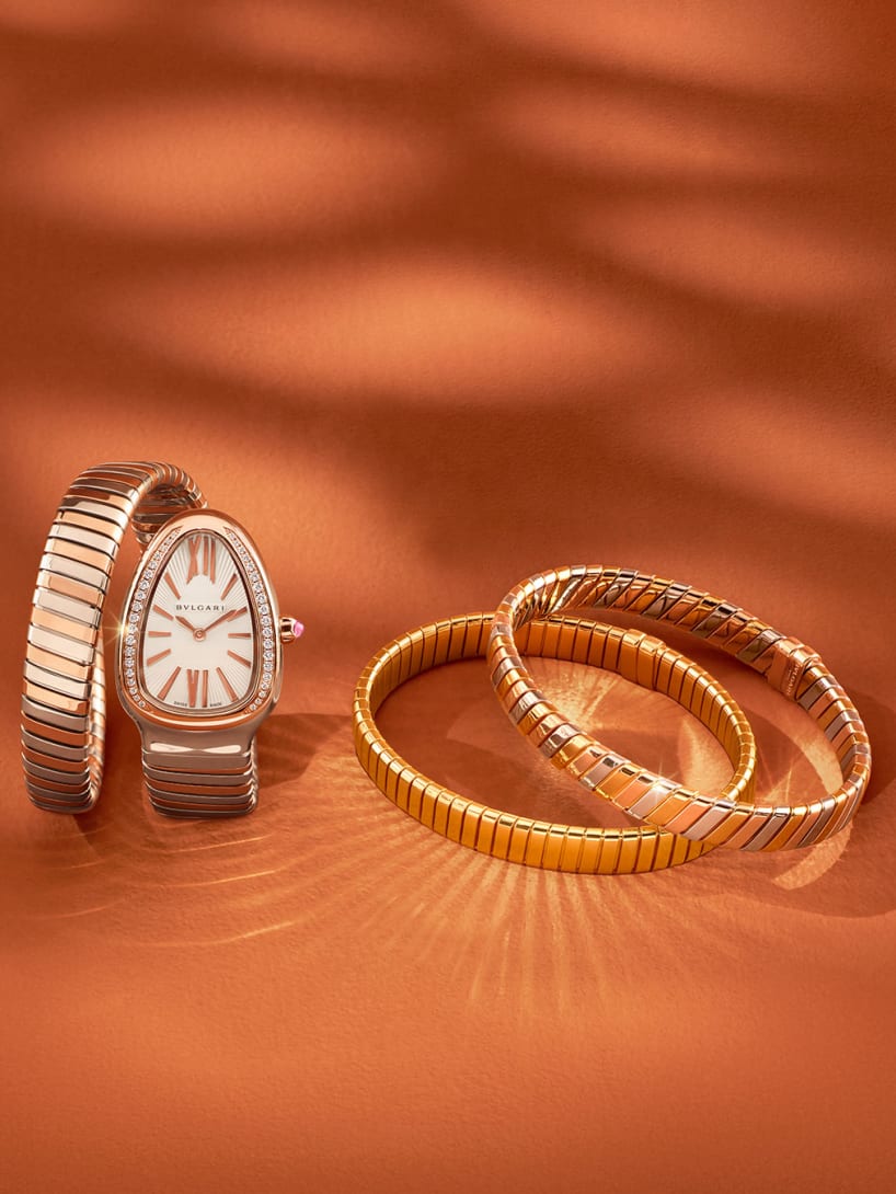 Serpenti Tubogas watch and Bvlgari Tubogas bracelets on an orange Diwali campaign backdrop.