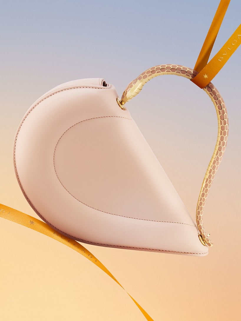 Bvlgari Cuore heart-shaped bag with metallic snake handle.