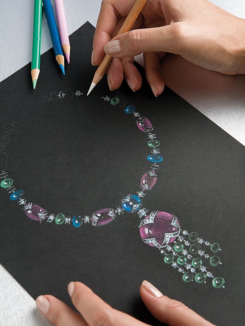 Hand paints a drawing of a Bvlgari necklace high jewelry.