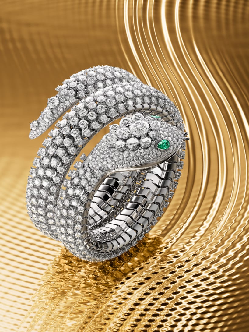 Serpenti Pallini High Jewellery secret watch in white gold entirely set with diamonds, creative shot.