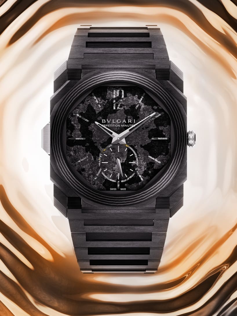 Octo Finissimo Minute Repeater ultra-thin chiming watch in black carbon with black dial, creative shot.