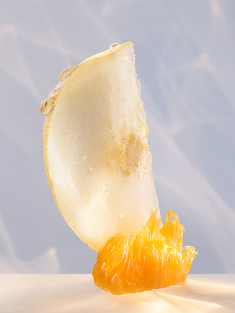 Nashi pear and mandarin essence, top notes of Omnia Crystalline Eau De Parfum, creative shot.