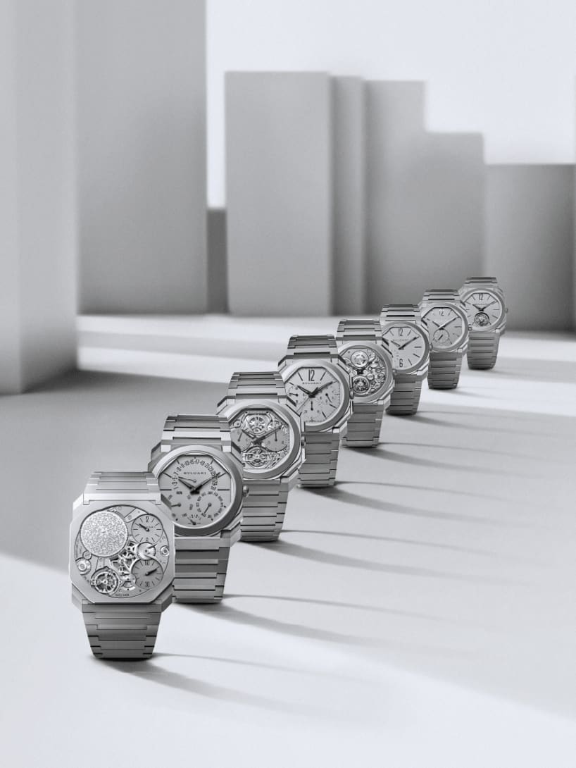 Octo Finissimo world records watches with different calibers and materials, white abstract backdrop.