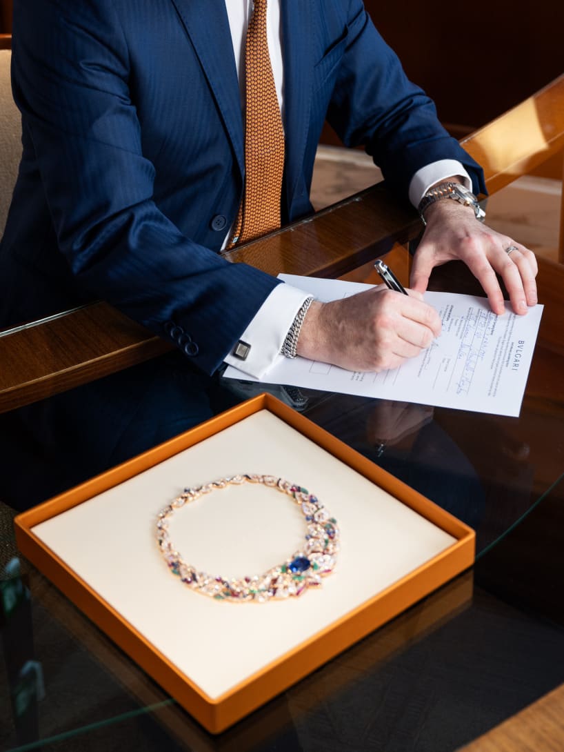 Close up of a person signing a contract