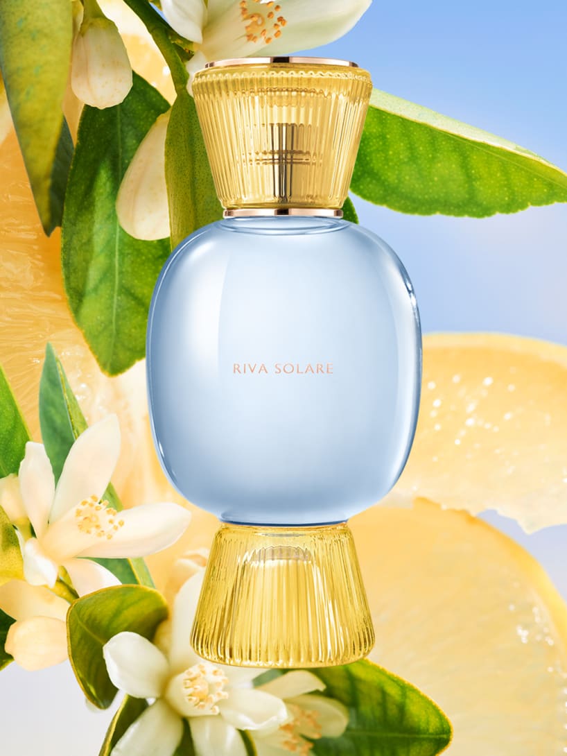 Bvlgari Riva Solare Allegra fragrance bottle in gold and azure glass.