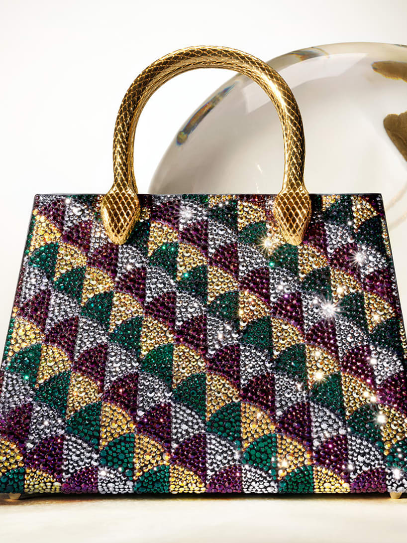 Serpentine Duo tote bag with a multi-colour pattern, Calla Crystals and handles shaped like a snake's body.