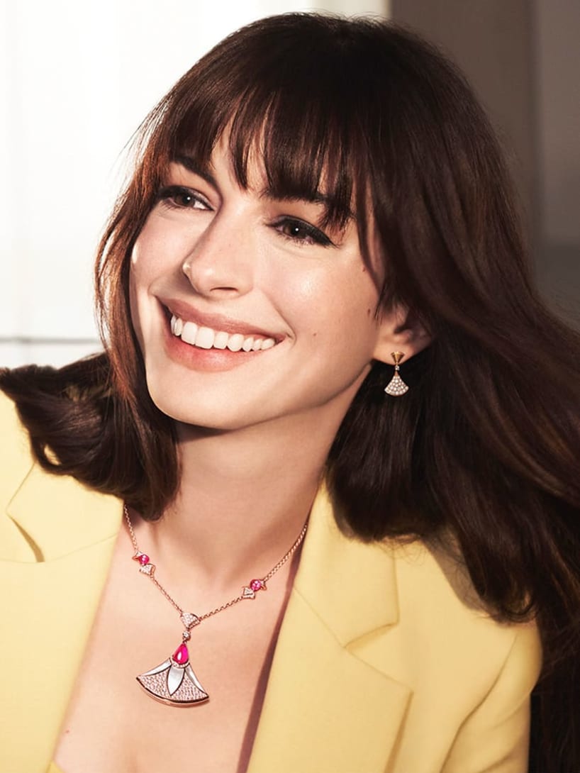 Anne Hathaway wearing a rose gold Divas' Dream necklace and earrings.