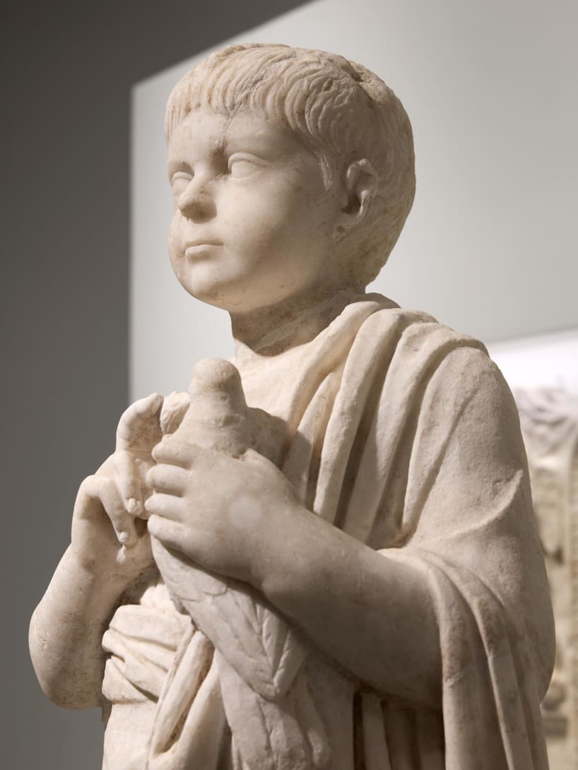 Bust of a young boy, part of the Torlonia Collection, on display at the Myth and Marble exhibition.