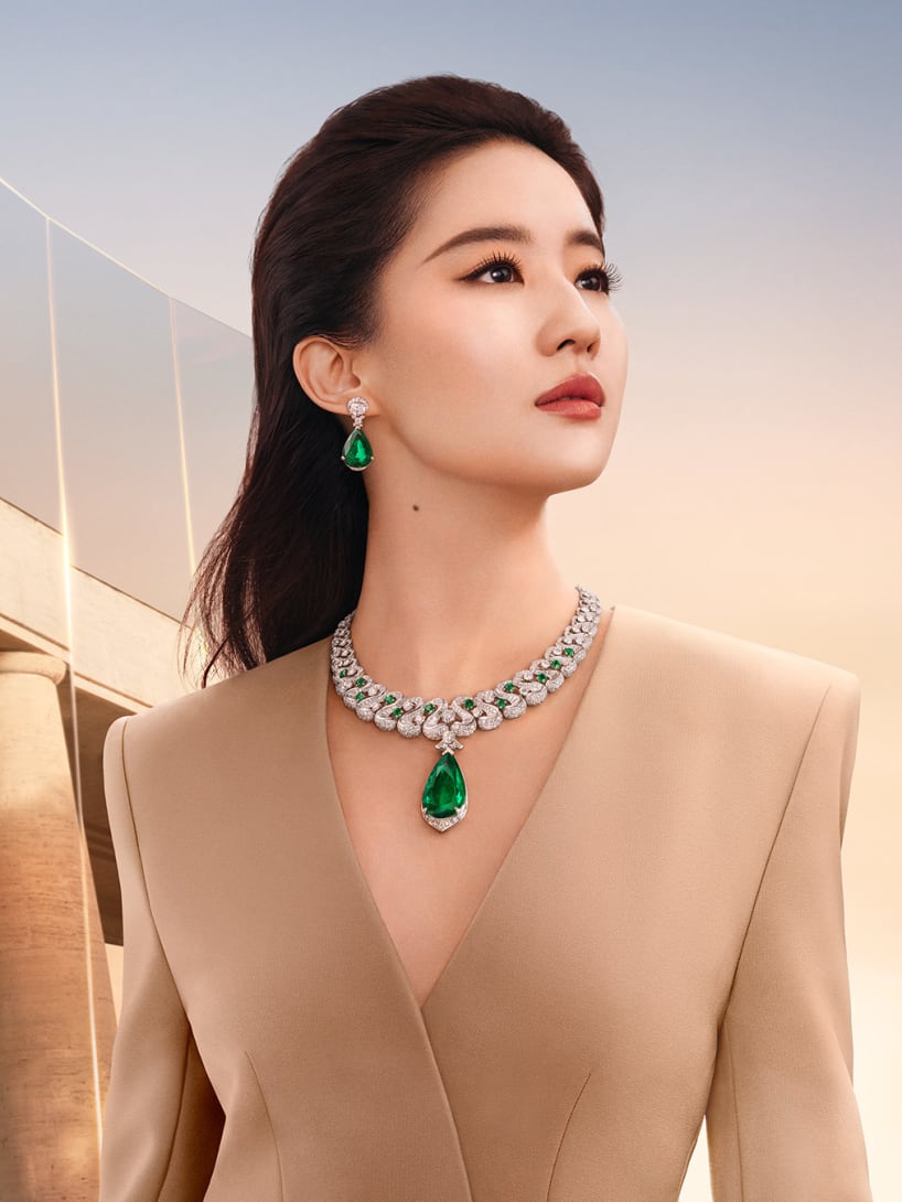 Liu Yifei wearing Bvlgari High Jewellery, dawn sky and Roman architecture in the background.