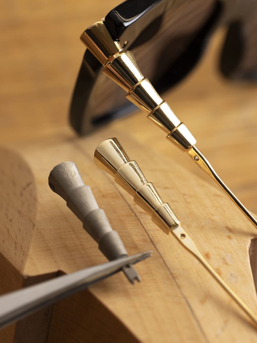 Making of Serpenti Viper glasses, assembling of the snake scale-inspired temples, close up.